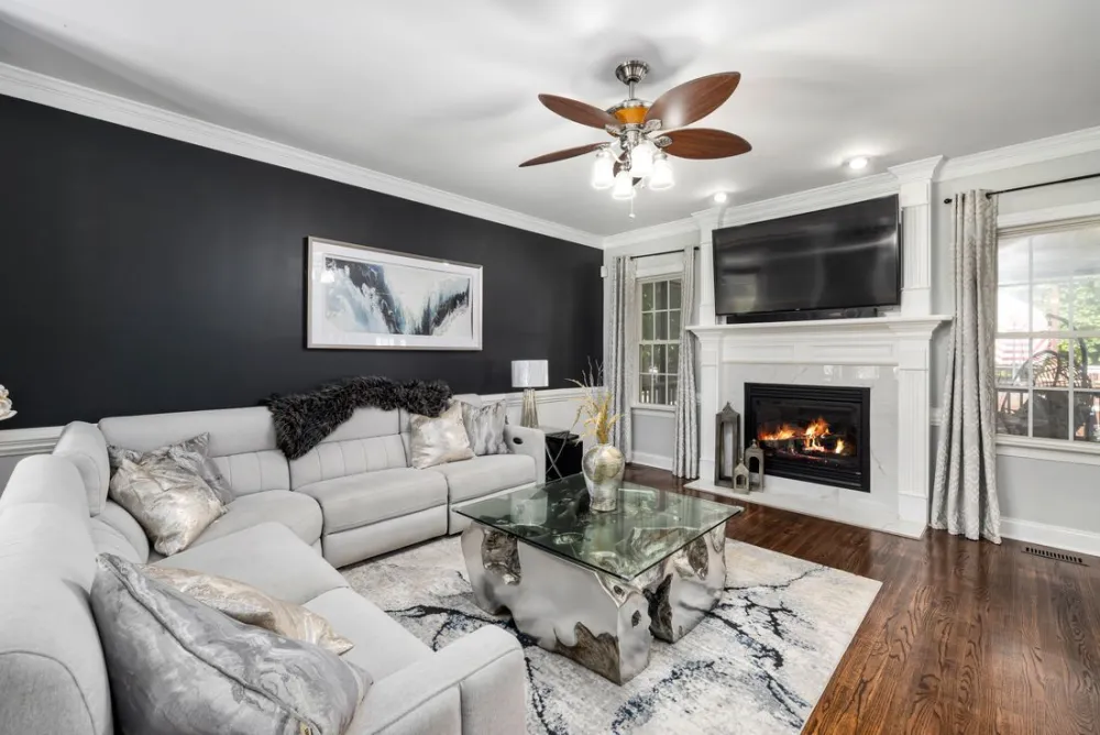 A bright, comfortable Central Valley living room lit with clean, modern lighting